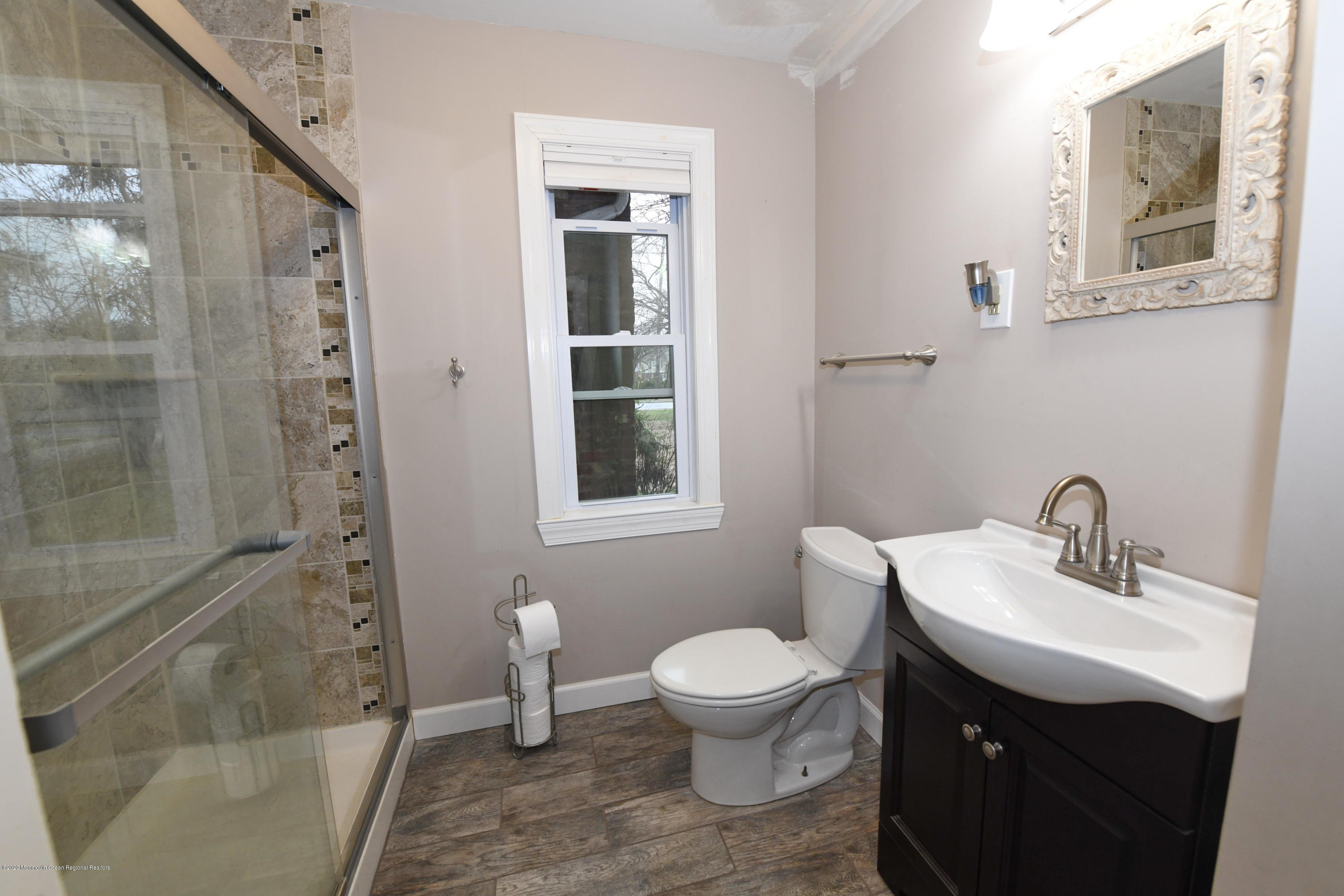 1871 Lanes Mill Road Brick, NJ 08724 - Photo 15 of 31 a bathroom with a sink toilet and shower