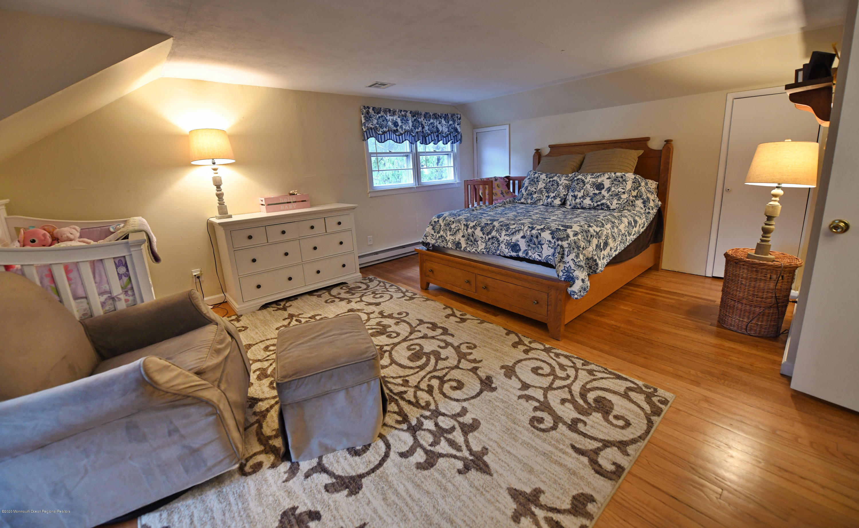 1871 Lanes Mill Road Brick, NJ 08724 - Photo 16 of 31 a bedroom with a bed and wooden floor