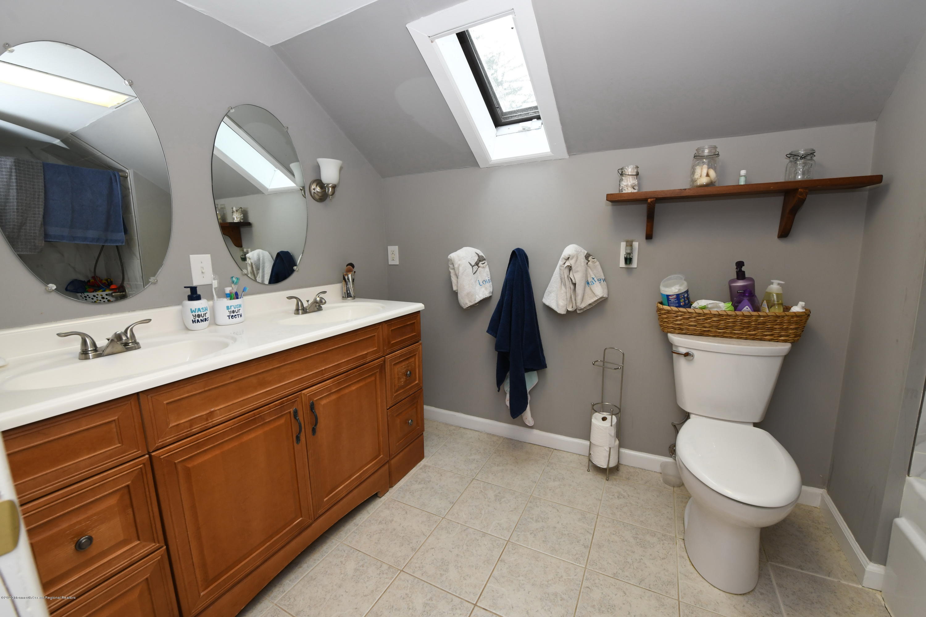 1871 Lanes Mill Road Brick, NJ 08724 - Photo 20 of 31 a bathroom with a toilet sink and mirror
