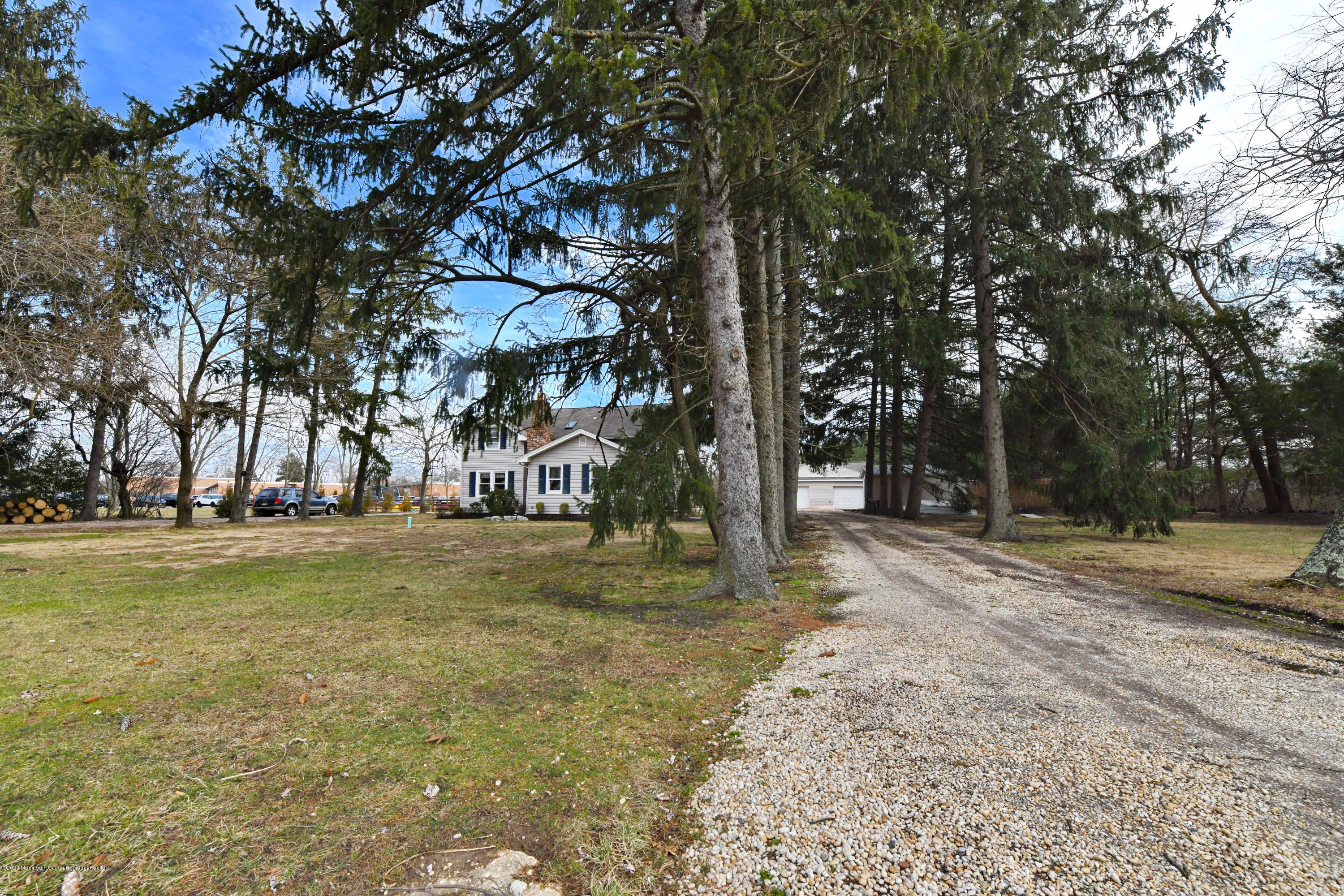 1871 Lanes Mill Road Brick, NJ 08724 - Photo 29 of 31 a view of a tree in front of a house