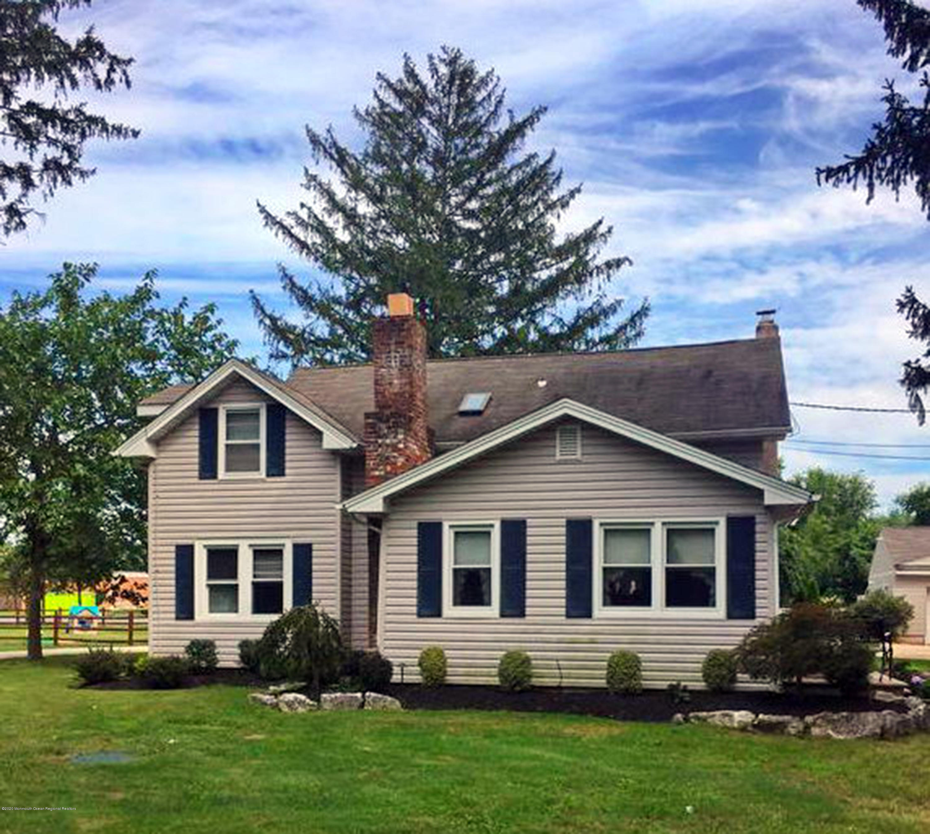 1871 Lanes Mill Road Brick, NJ 08724 - Photo 4 of 31 a front view of a house with a yard