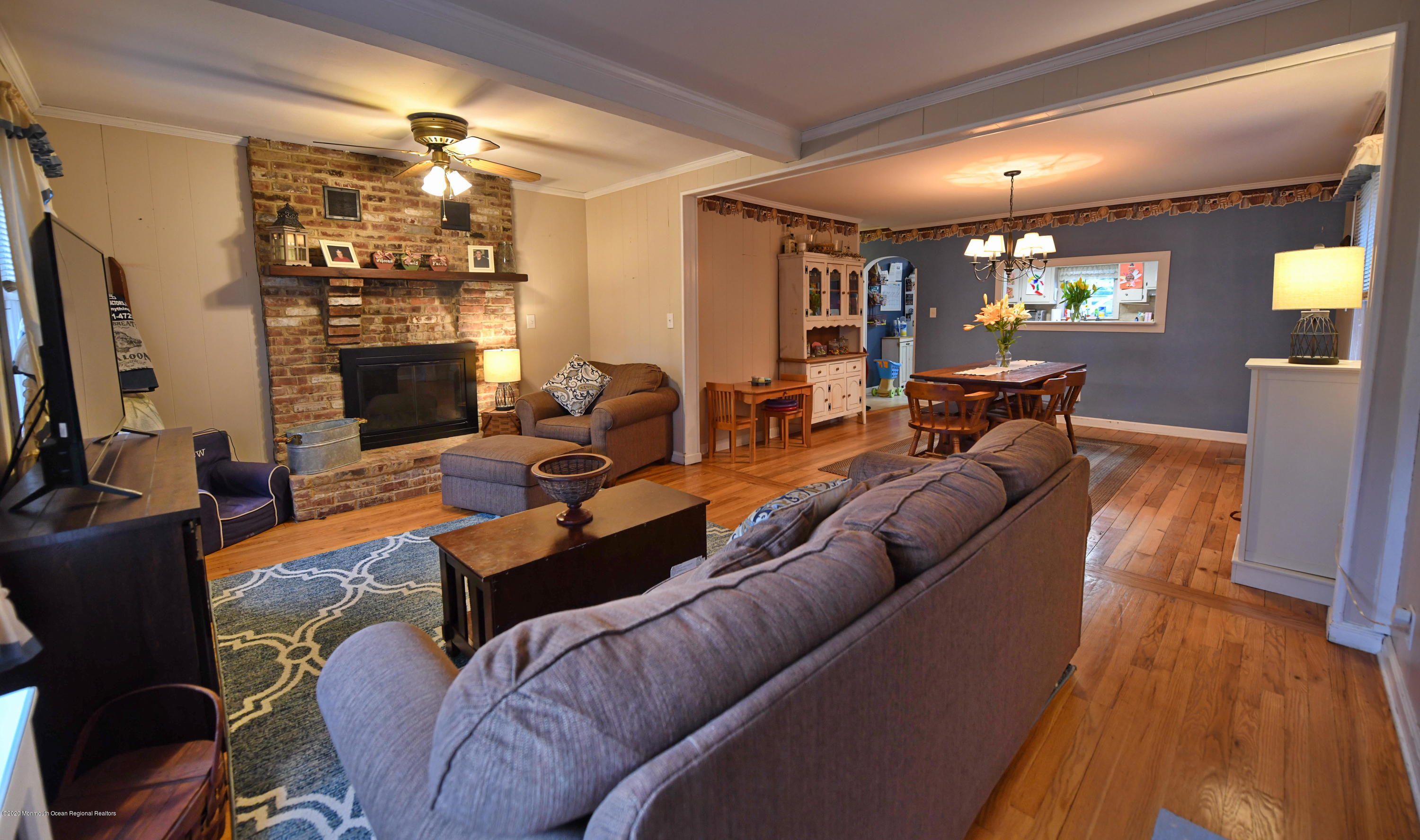 1871 Lanes Mill Road Brick, NJ 08724 - Photo 5 of 31 a living room with furniture a lamp wooden floor and a fireplace