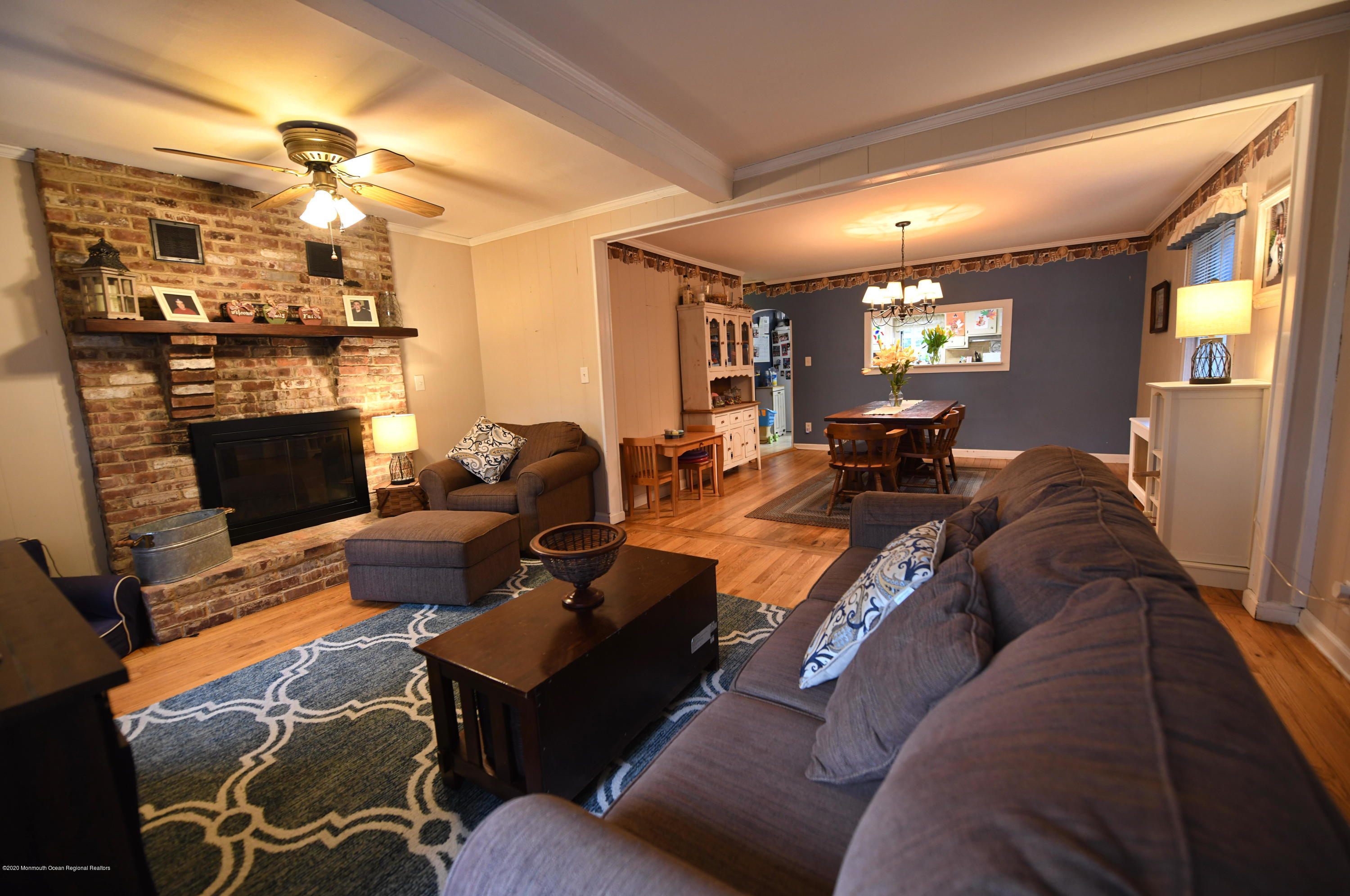 1871 Lanes Mill Road Brick, NJ 08724 - Photo 6 of 31 a living room with furniture a fireplace and a chandelier