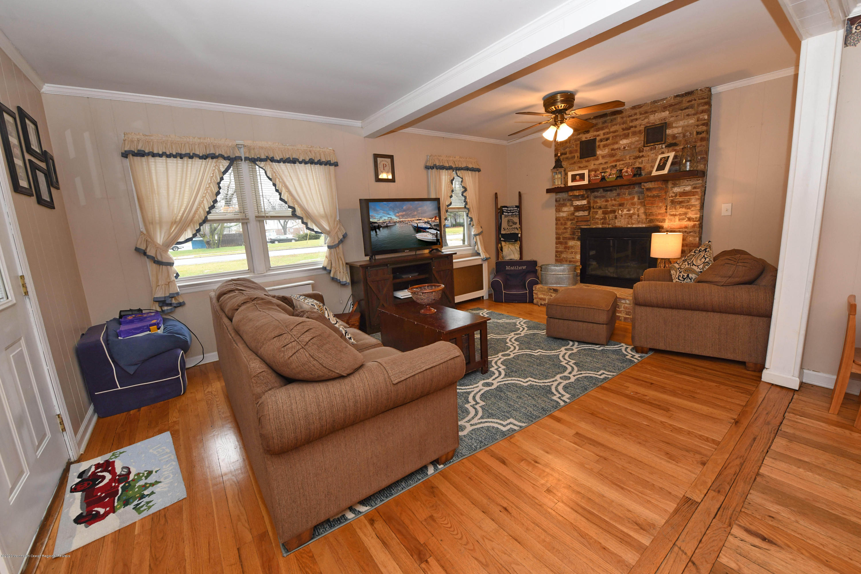 1871 Lanes Mill Road Brick, NJ 08724 - Photo 7 of 31 a living room with furniture a large window and a fireplace