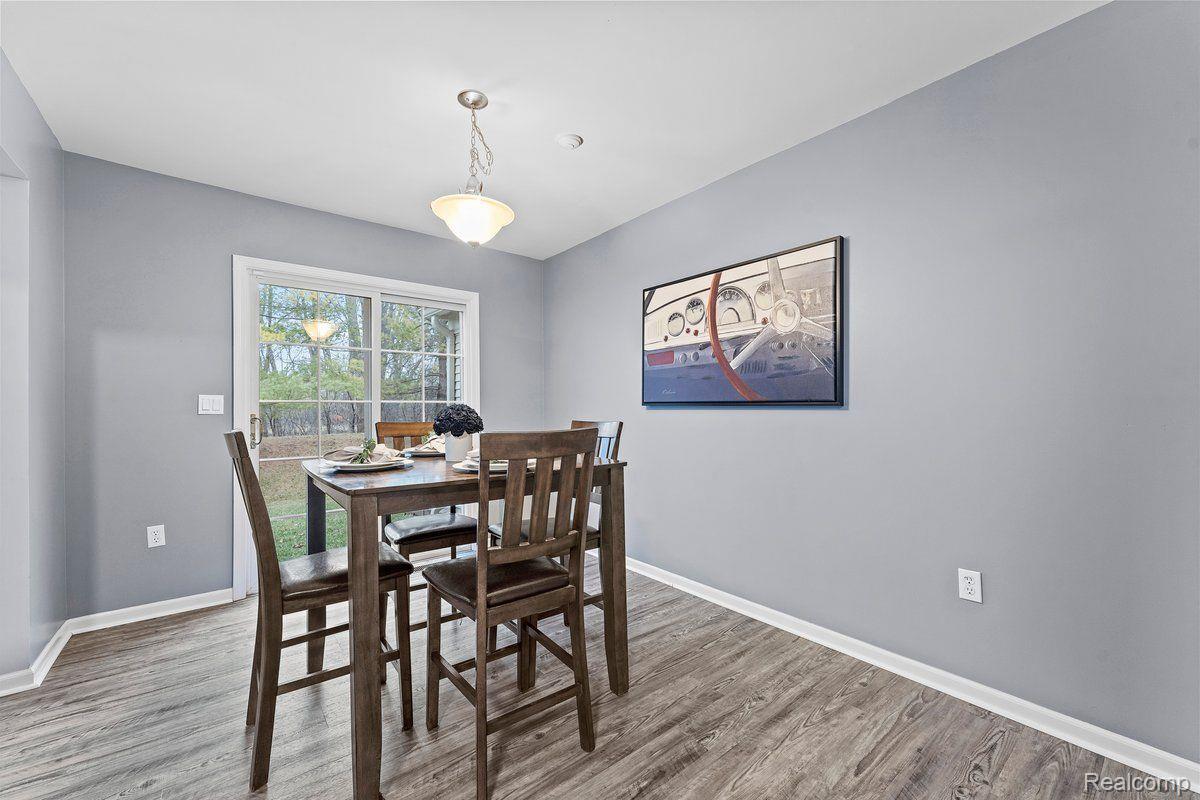 49091 Hawksburry Road Canton, MI 48188 - Photo 13 of 37 Dining room with sliding door wall to backyard