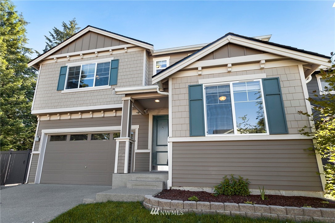 18504 115th Place Southeast Renton, WA 98055 - Photo 1 of 40 a front view of a house with a yard and garage