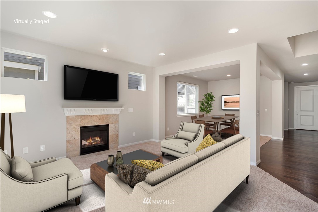 18504 115th Place Southeast Renton, WA 98055 - Photo 15 of 40 a living room with furniture flat screen tv and a fireplace