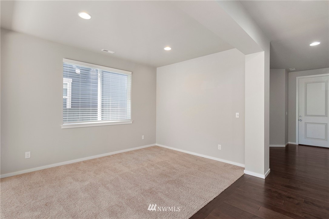 18504 115th Place Southeast Renton, WA 98055 - Photo 17 of 40 wooden floor in an empty room with a window
