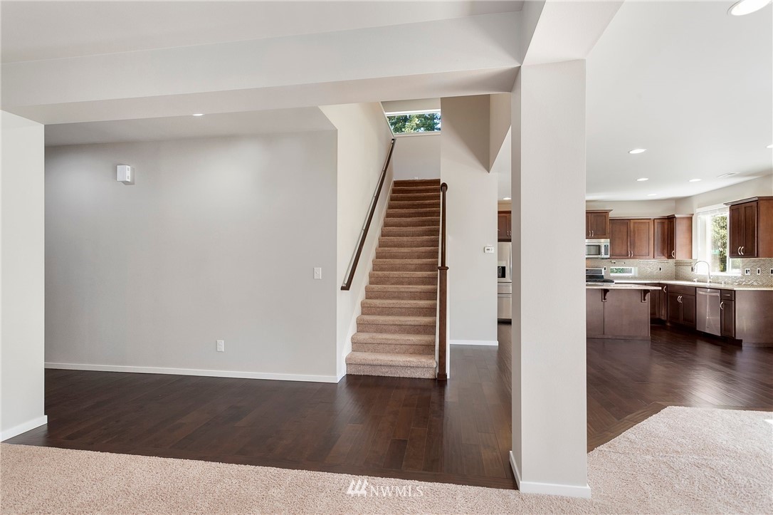 18504 115th Place Southeast Renton, WA 98055 - Photo 18 of 40 a view of kitchen and hall with wooden floor