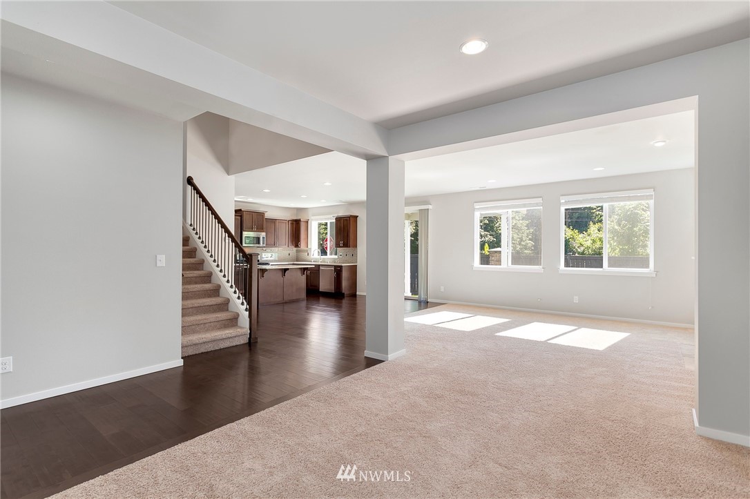 18504 115th Place Southeast Renton, WA 98055 - Photo 3 of 40 wooden floor in an empty room with a window and wooden floor