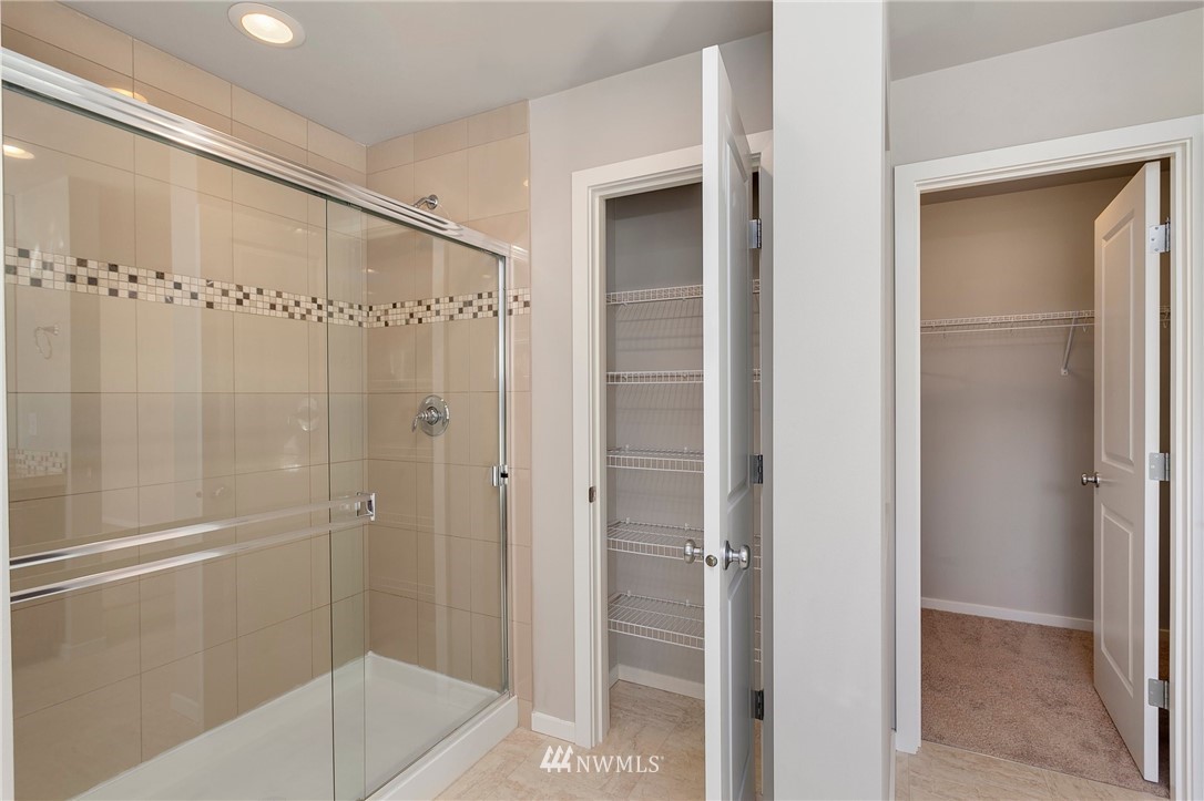 18504 115th Place Southeast Renton, WA 98055 - Photo 23 of 40 a bathroom with a glass shower door