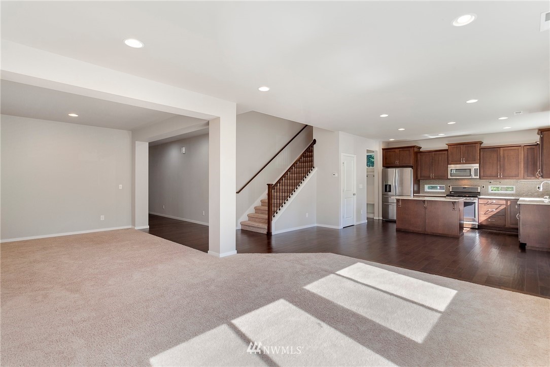 18504 115th Place Southeast Renton, WA 98055 - Photo 5 of 40 a living room with furniture and kitchen view