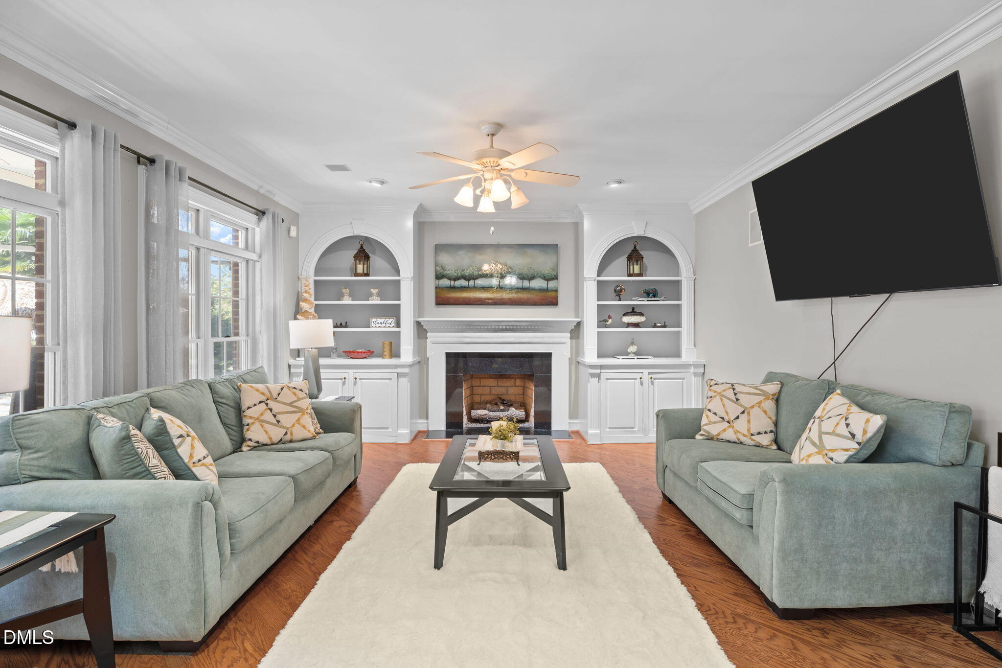 5870 Hoyt Road Middlesex, NC 27557 - Photo 14 of 33 a living room with furniture a fireplace and a flat screen tv