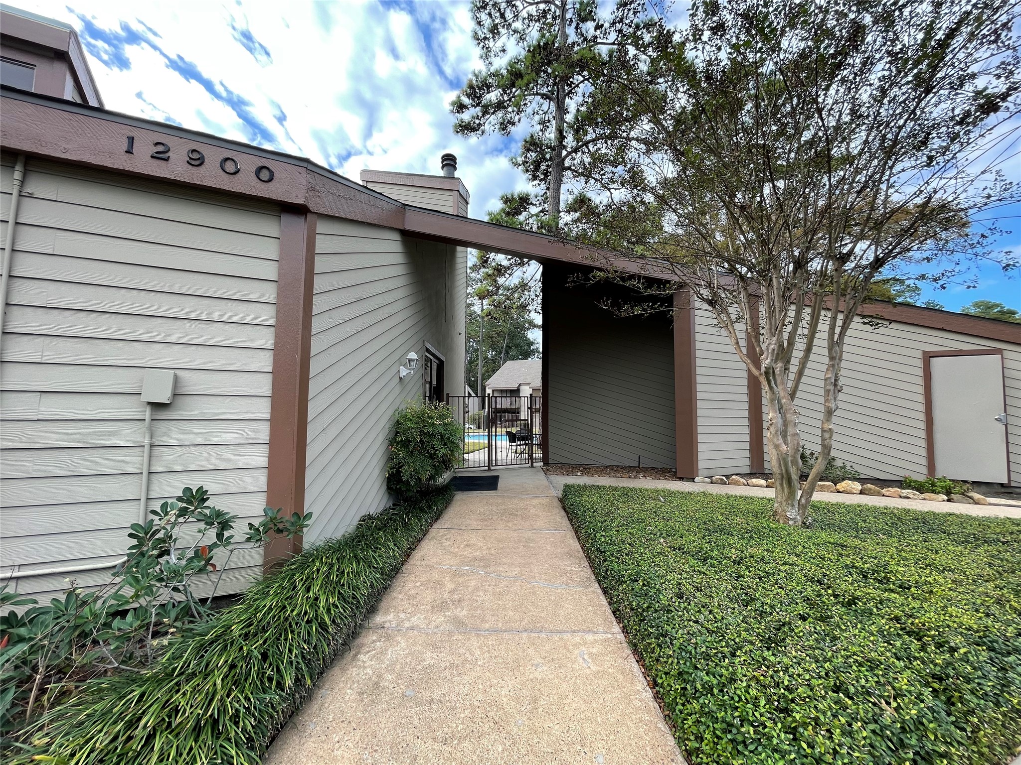 12900 Walden Road, Unit 216B Montgomery, TX 77356 - Photo 19 of 44 Pool Entrance at The 18th At Walden