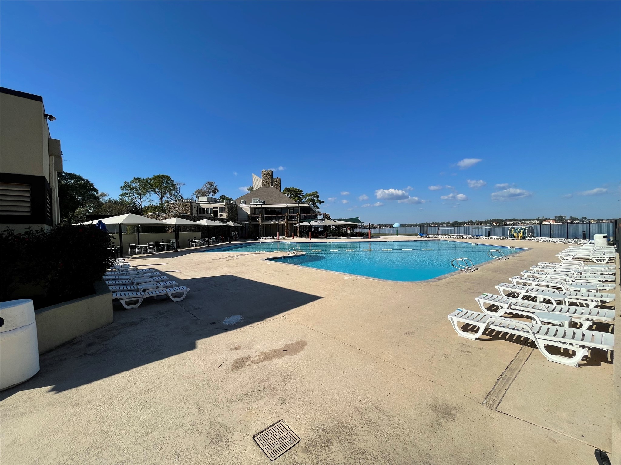 12900 Walden Road, Unit 216B Montgomery, TX 77356 - Photo 36 of 44 View of pool and Lake Conroe