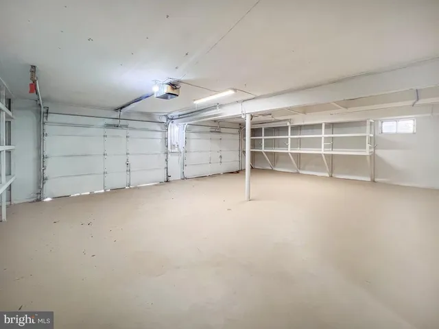 an empty room with a empty space and windows