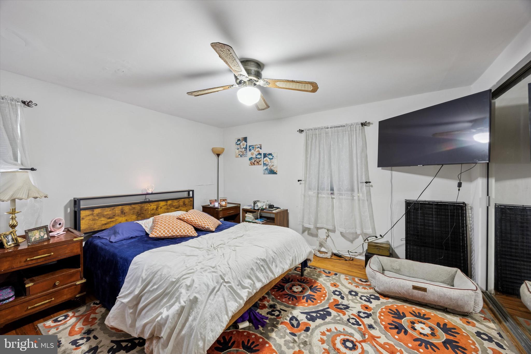 2831 Chase Road Philadelphia, PA 19152 - Photo 12 of 26 a bedroom with a bed and a flat screen tv