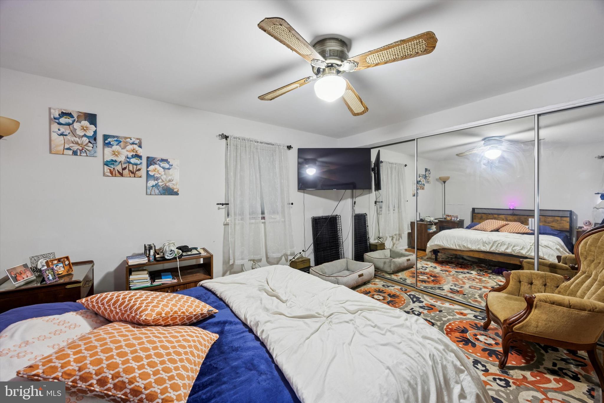 2831 Chase Road Philadelphia, PA 19152 - Photo 13 of 26 a bedroom with a bed and a chandelier