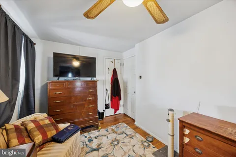 a bedroom with a bed and flat screen tv