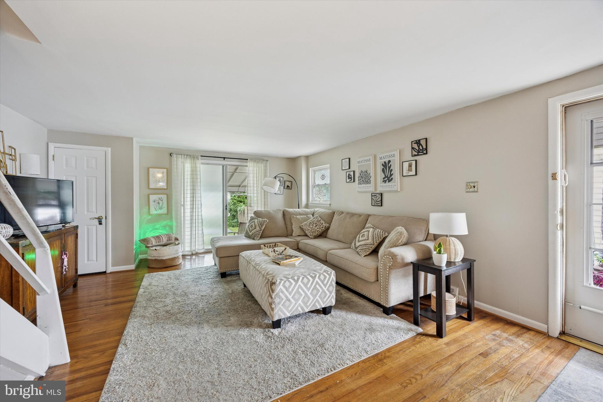 2831 Chase Road Philadelphia, PA 19152 - Photo 2 of 26 a living room with furniture and a flat screen tv