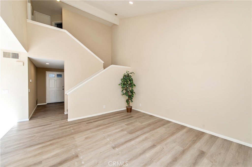335 Stanford Court Irvine, CA 92612 - Photo 16 of 31 a view of a hallway with wooden floor