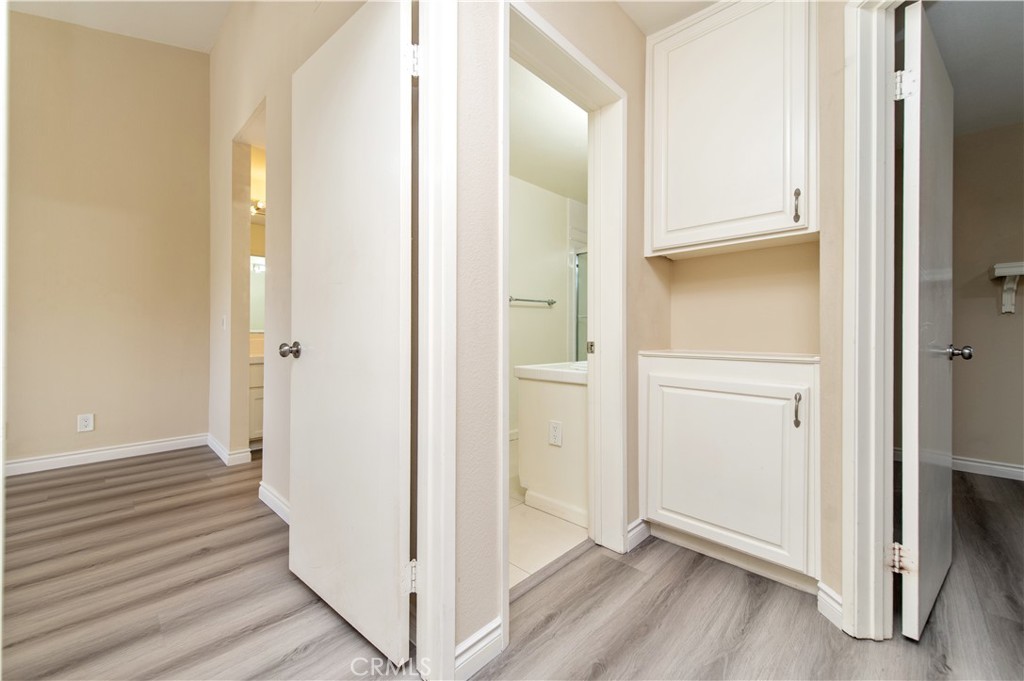 335 Stanford Court Irvine, CA 92612 - Photo 18 of 31 a view of a hallway with wooden floor