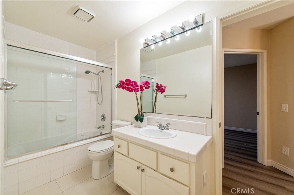 335 Stanford Court Irvine, CA 92612 - Photo 22 of 31 a bathroom with a sink vanity mirror and shower