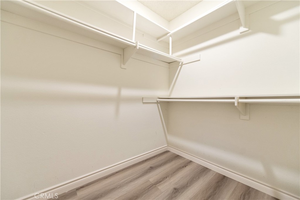 335 Stanford Court Irvine, CA 92612 - Photo 23 of 31 a view of an empty walk in closet