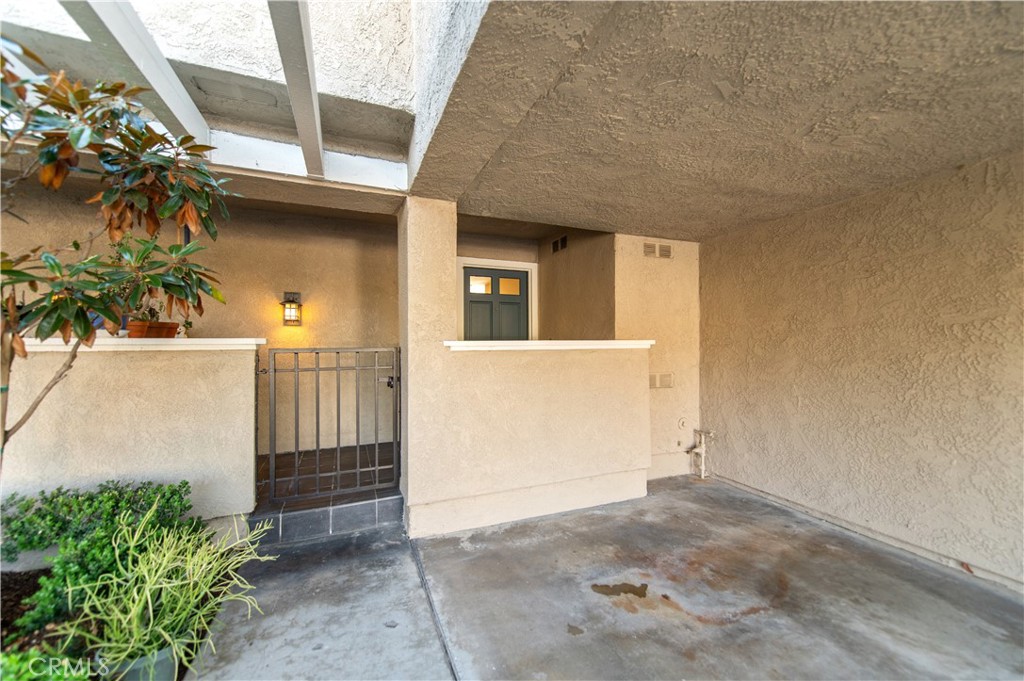 335 Stanford Court Irvine, CA 92612 - Photo 31 of 31 a view of a brick house with a small yard