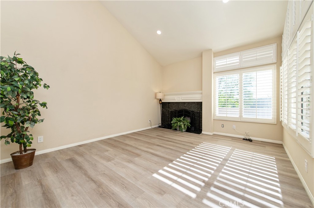 335 Stanford Court Irvine, CA 92612 - Photo 6 of 31 a view of an empty room with a window and fire place