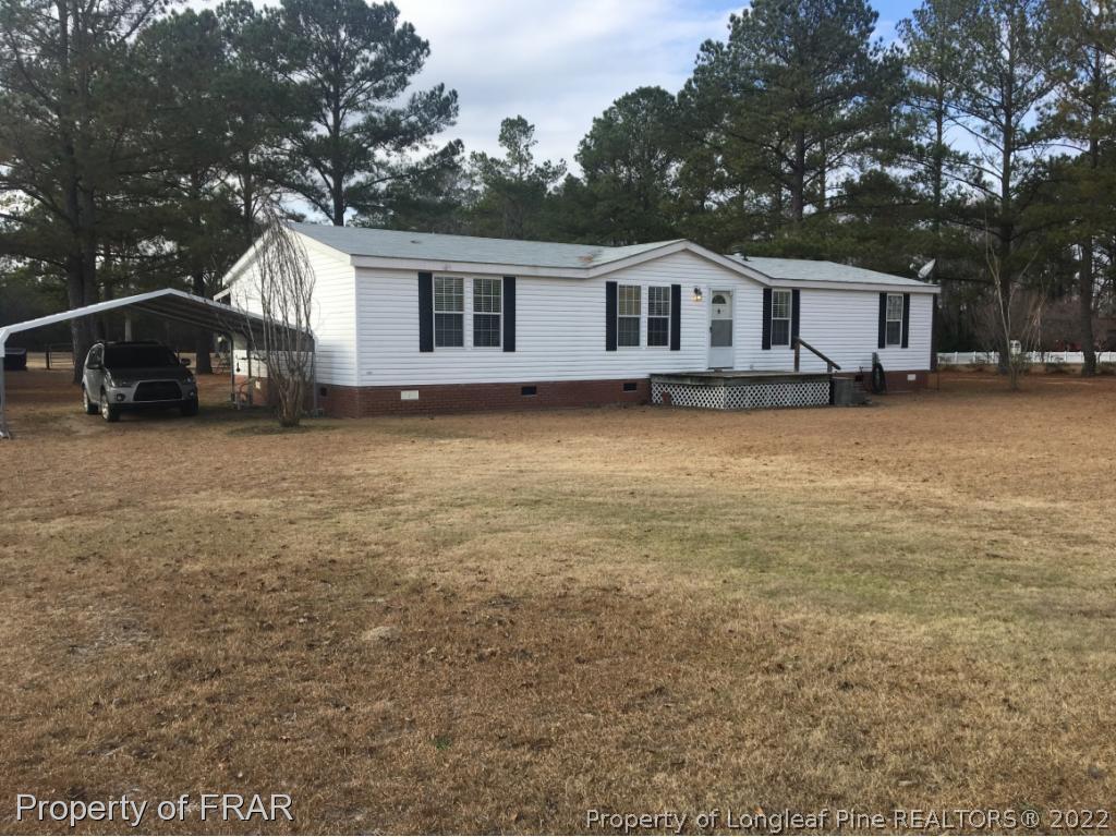 1981 Wade-Stedman Road Stedman, NC 28391 - Photo 1 of 13 a house view with a garden space