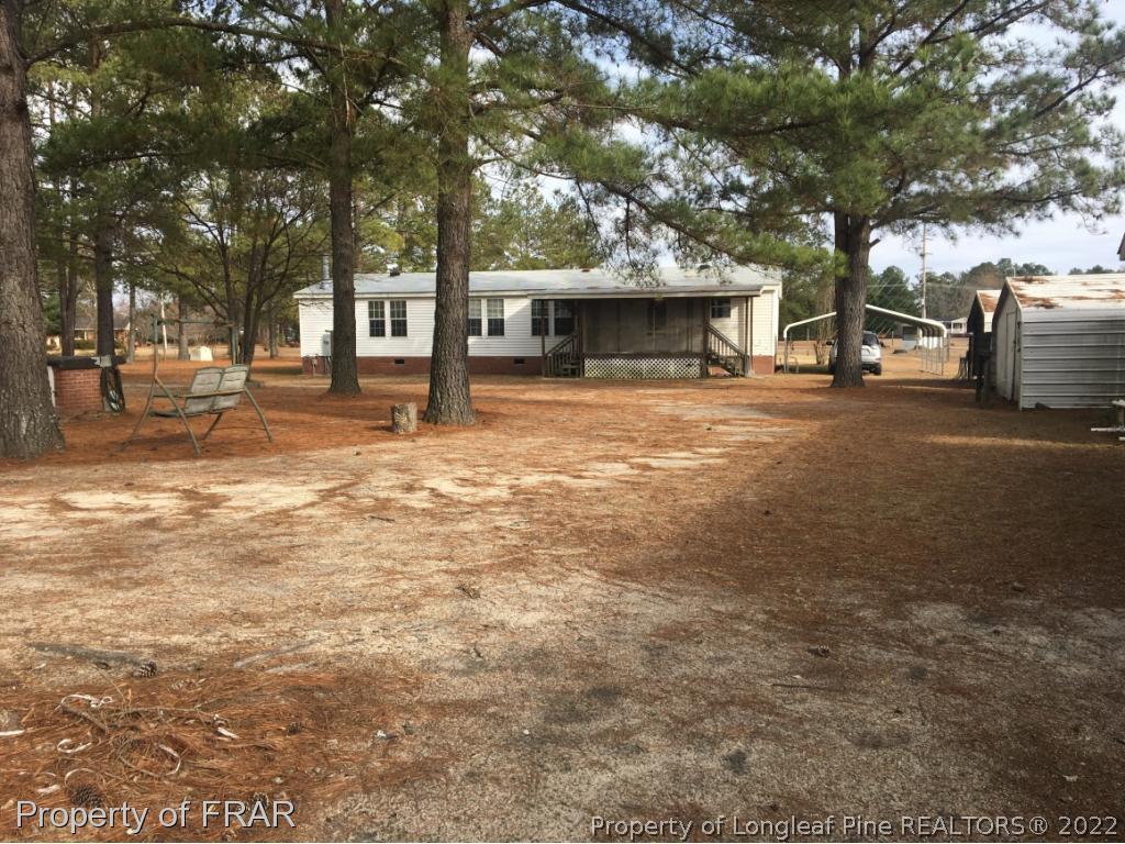 1981 Wade-Stedman Road Stedman, NC 28391 - Photo 13 of 13 a view of a house with a tree