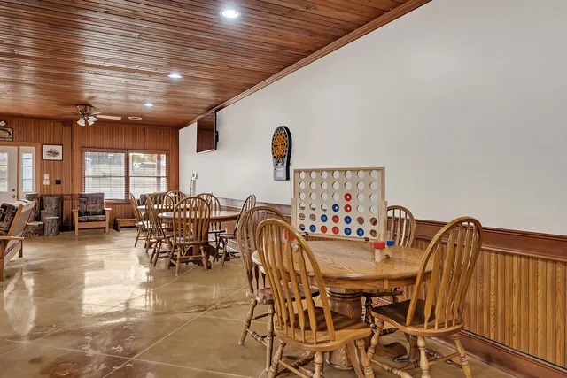 a room with pool table table tennis pool table and chairs