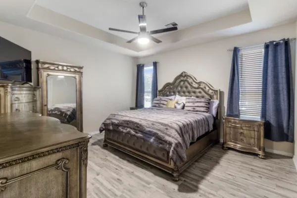 a backyard of a house with table and chairs