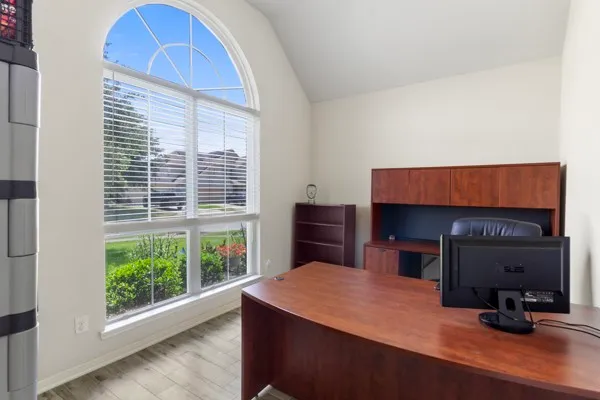 a living room with a fireplace and a flat screen tv