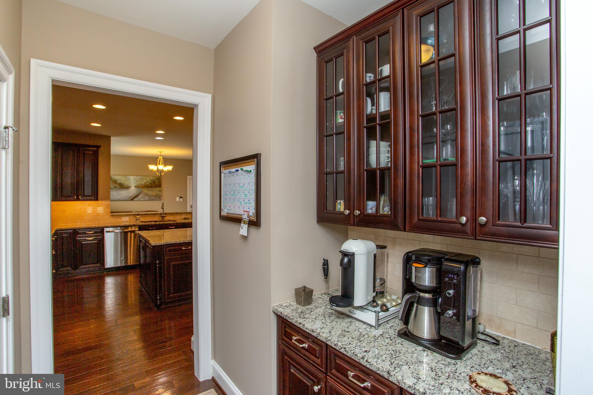 4682 Plough Tavern Road Doylestown, PA 18902 - Photo 16 of 42 a kitchen with stainless steel appliances granite countertop a refrigerator and a stove top oven