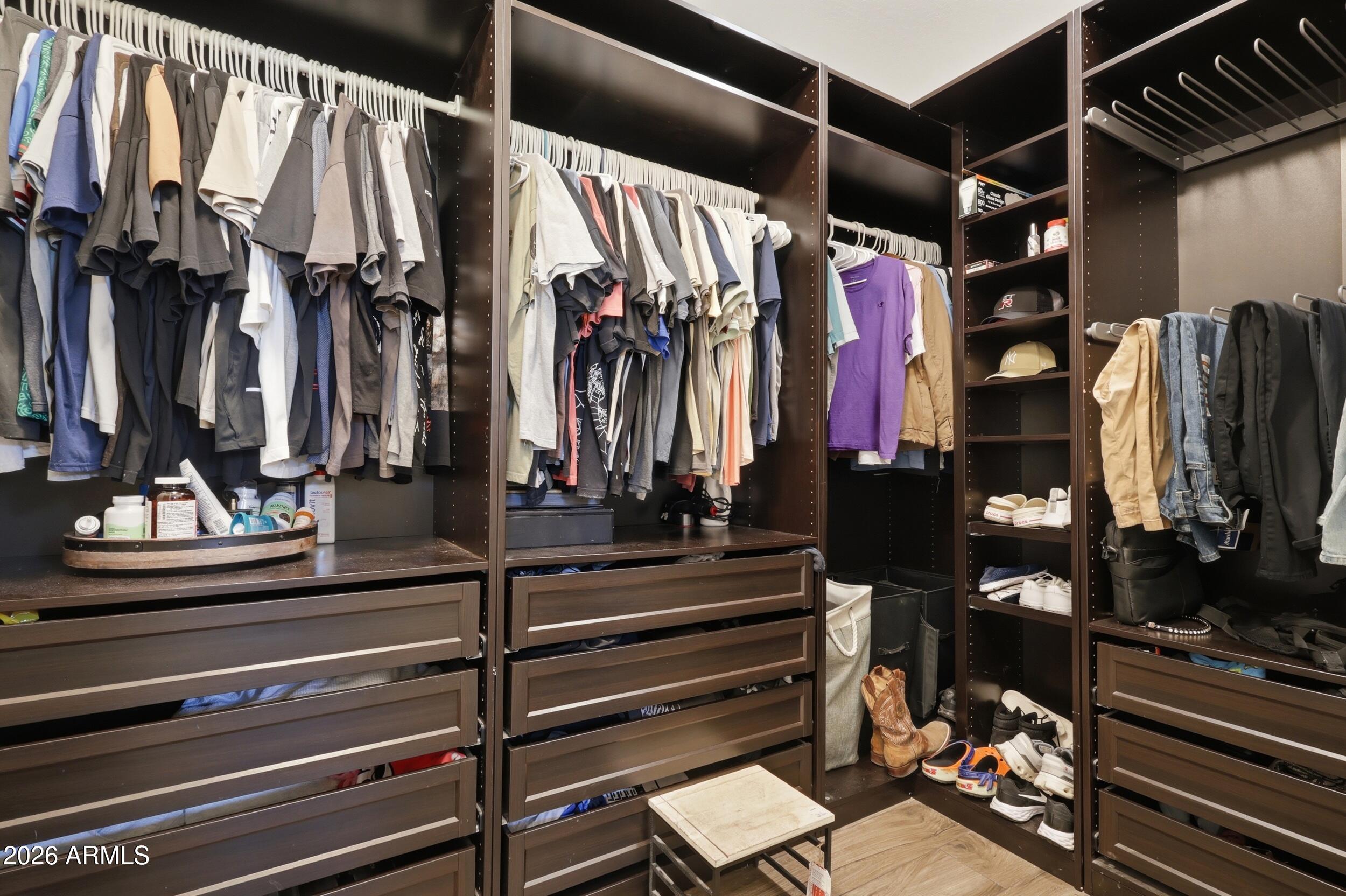 12517 West Lawrence Road Glendale, AZ 85307 - Photo 34 of 52 a view of walk in closet with clothes and shoes