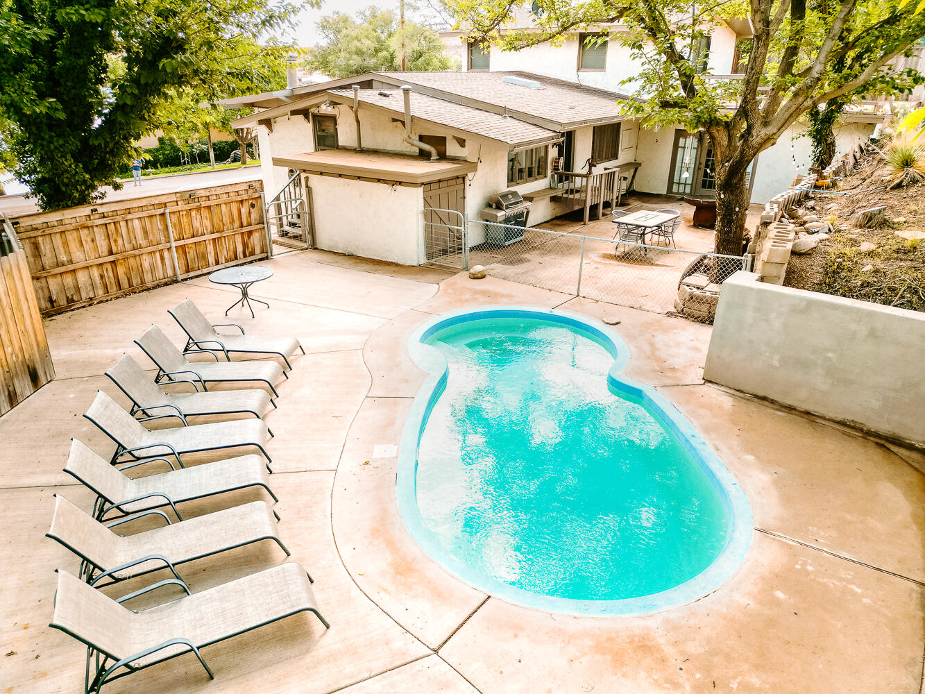 585 Comanche Drive Lubbock, TX 79404 - Photo 16 of 17 a view of a swimming pool with a patio