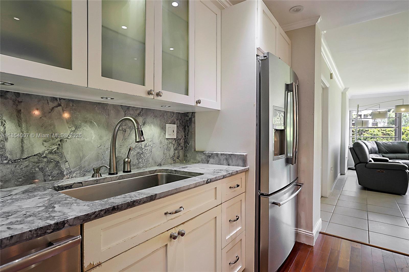 1700 Northeast 105th Street, Unit 203 Miami Shores, FL 33138 - Photo 15 of 45 a view of a kitchen with sink and refrigerator