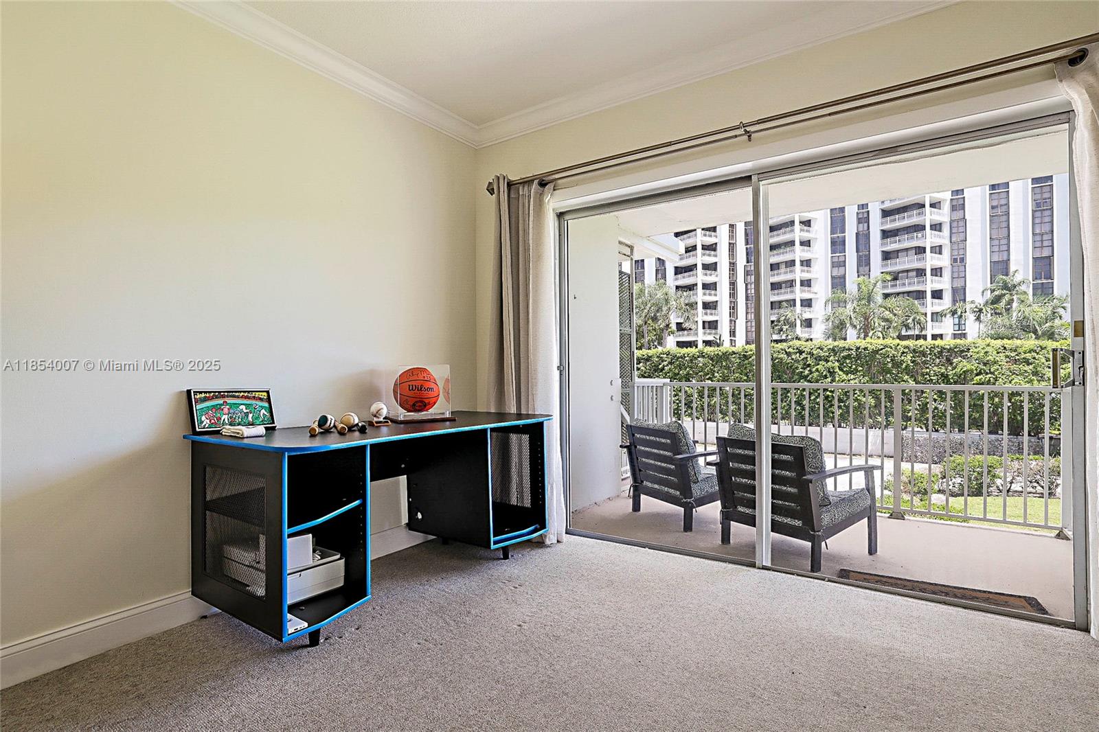 1700 Northeast 105th Street, Unit 203 Miami Shores, FL 33138 - Photo 20 of 45 a bed room with a bed and a window