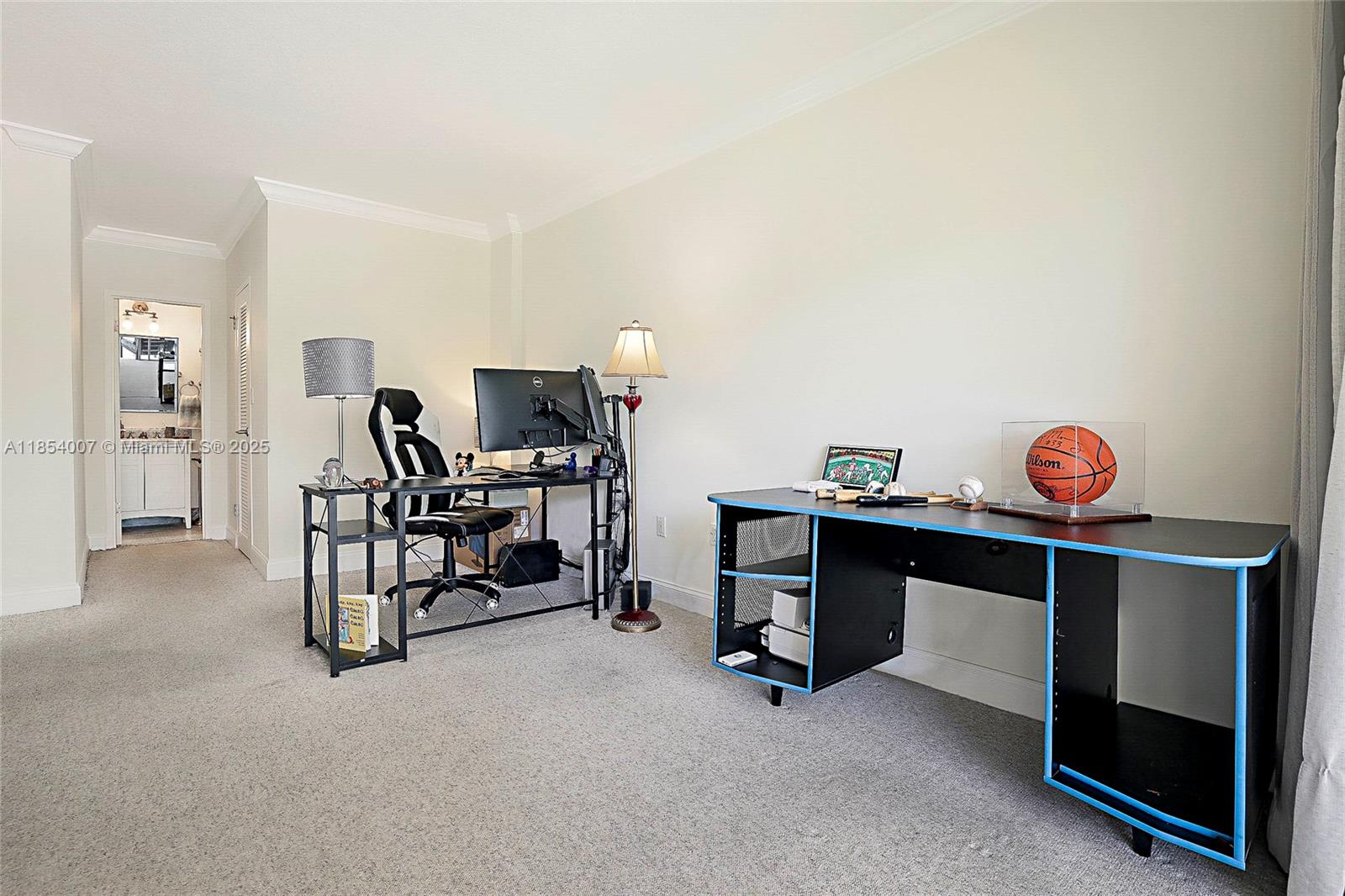 1700 Northeast 105th Street, Unit 203 Miami Shores, FL 33138 - Photo 22 of 45 a view of a livingroom with furniture and a table