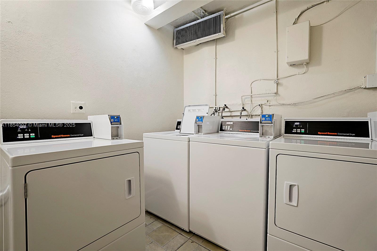 1700 Northeast 105th Street, Unit 203 Miami Shores, FL 33138 - Photo 28 of 45 a utility room with dryer and washer