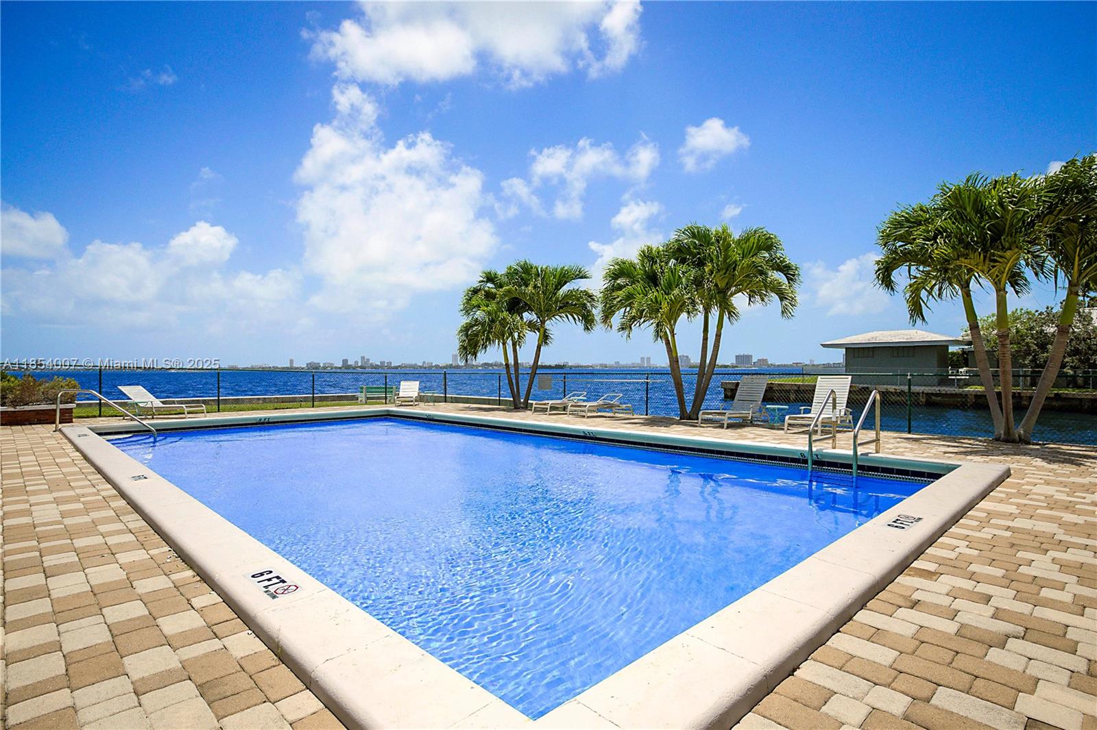 1700 Northeast 105th Street, Unit 203 Miami Shores, FL 33138 - Photo 29 of 45 a view of swimming pool with lounge chair