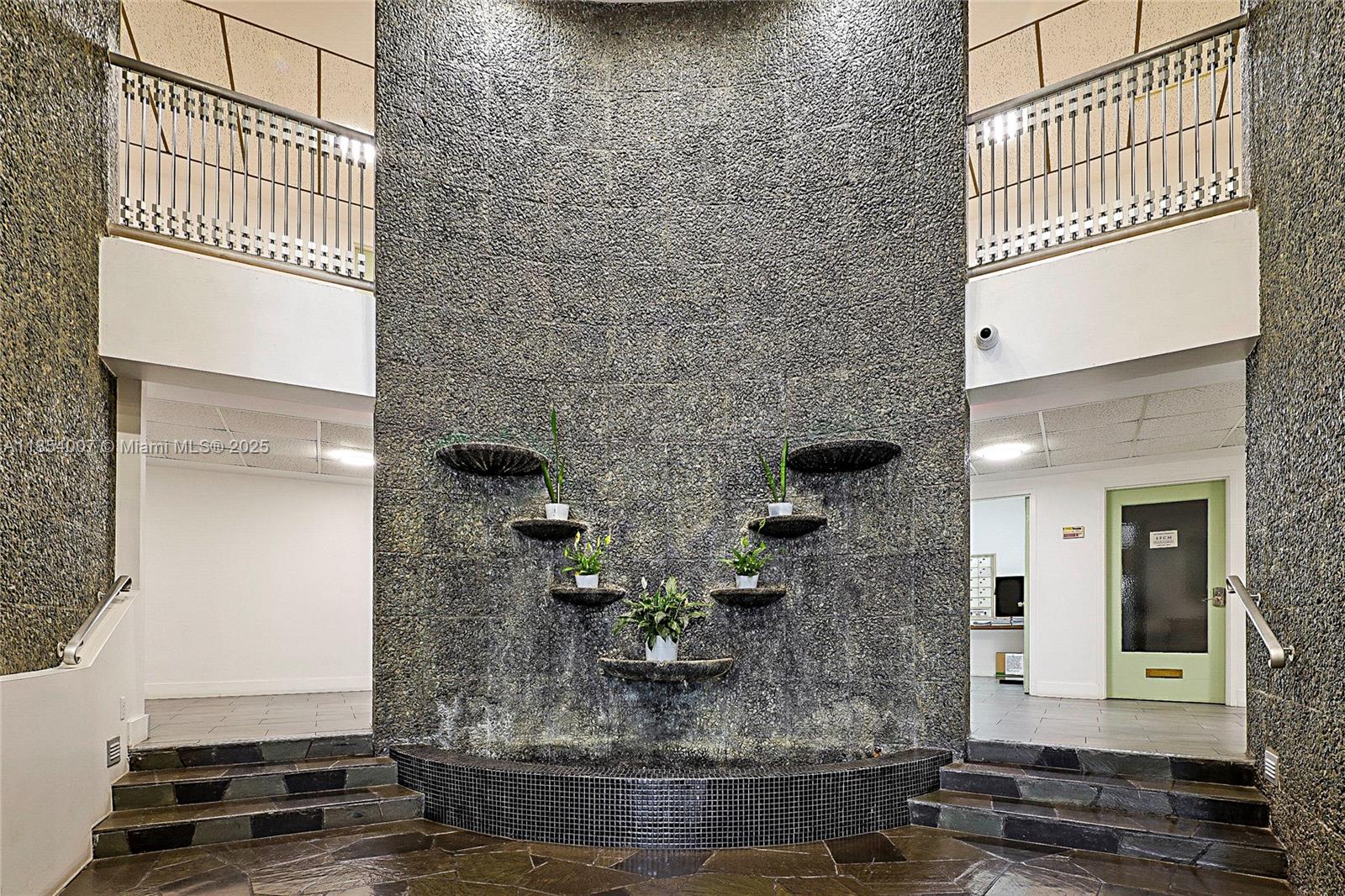 1700 Northeast 105th Street, Unit 203 Miami Shores, FL 33138 - Photo 33 of 45 a vase of flowers sitting on a table