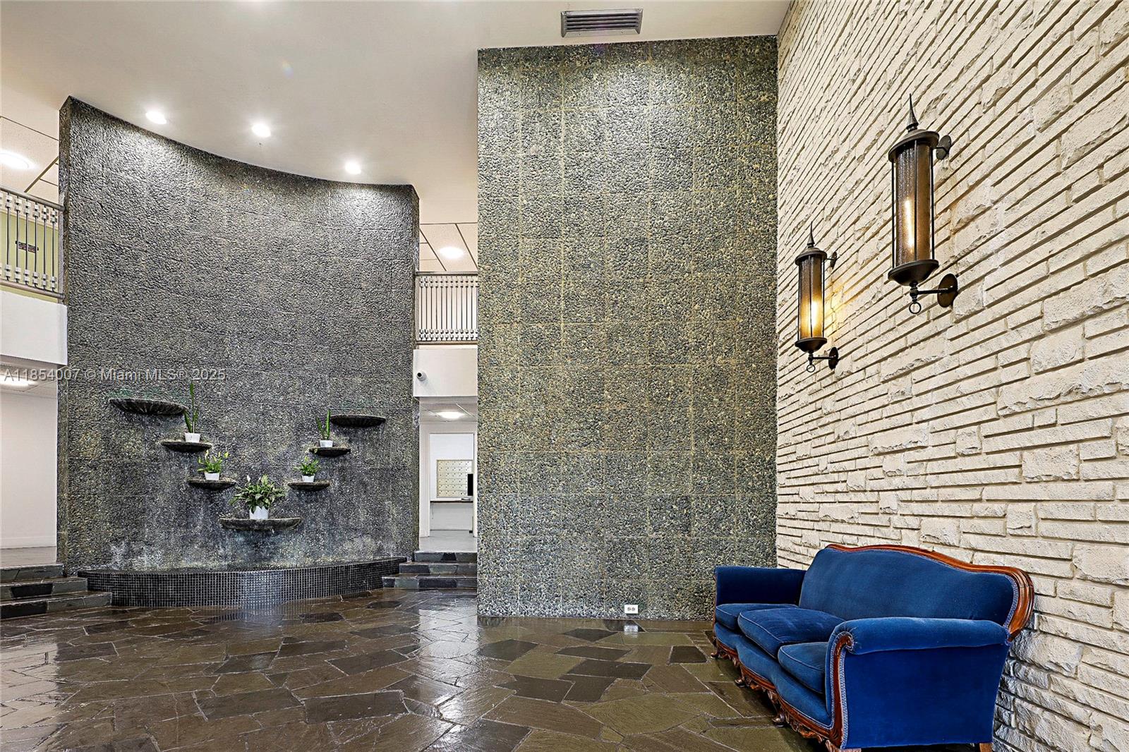 1700 Northeast 105th Street, Unit 203 Miami Shores, FL 33138 - Photo 34 of 45 a view of hall way with furniture