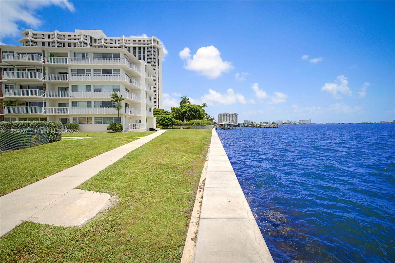 1700 Northeast 105th Street, Unit 203 Miami Shores, FL 33138 - Photo 40 of 45 a view of building with yard