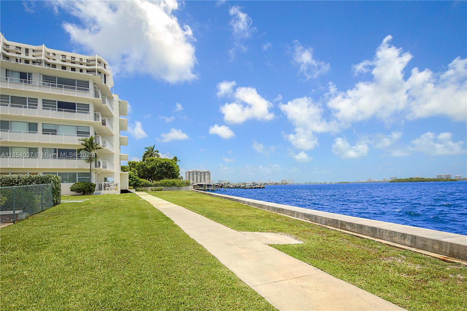 1700 Northeast 105th Street, Unit 203 Miami Shores, FL 33138 - Photo 41 of 45 a view of an outdoor space and swimming pool