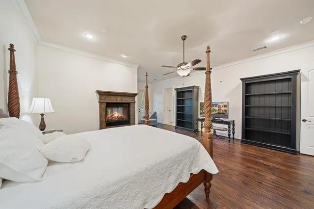 a bedroom with a bed and a fireplace