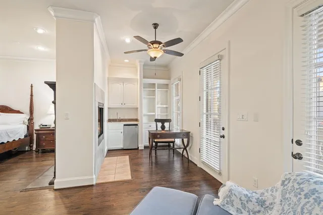 a view of a livingroom with furniture and hardwood floor