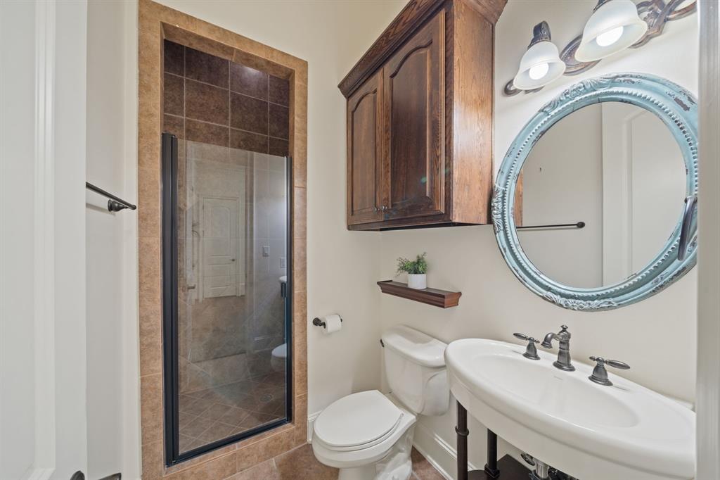 34 Piazza Lane Colleyville, TX 76034 - Photo 29 of 38 a bathroom with a toilet a sink and a mirror